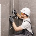 What safety precautions do you take to ensure safety while working at a plumbing site?