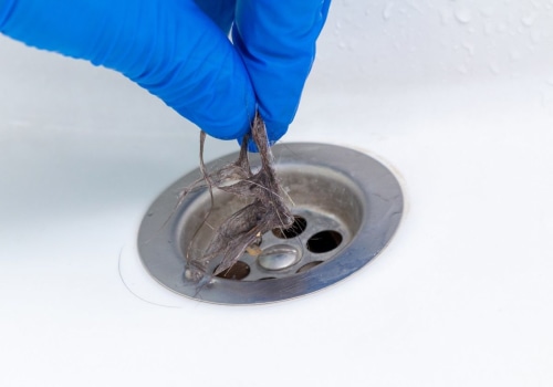 What are the common causes of blocked drains?
